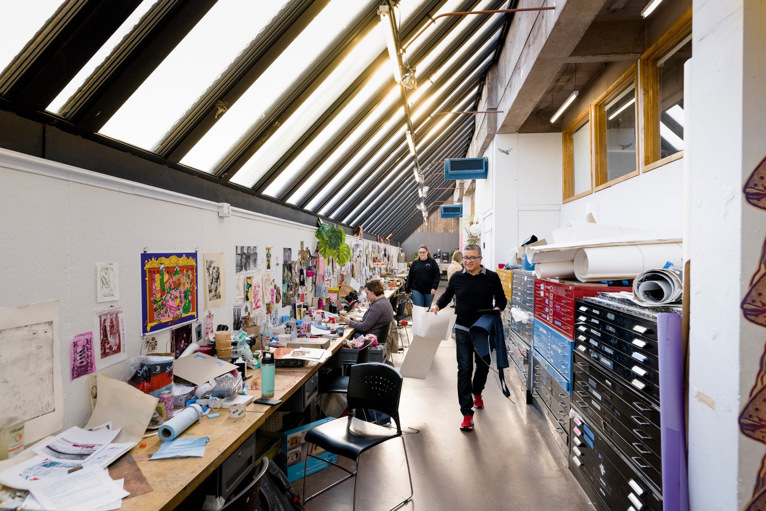 Students work on their own creations in the Printmaking Studio